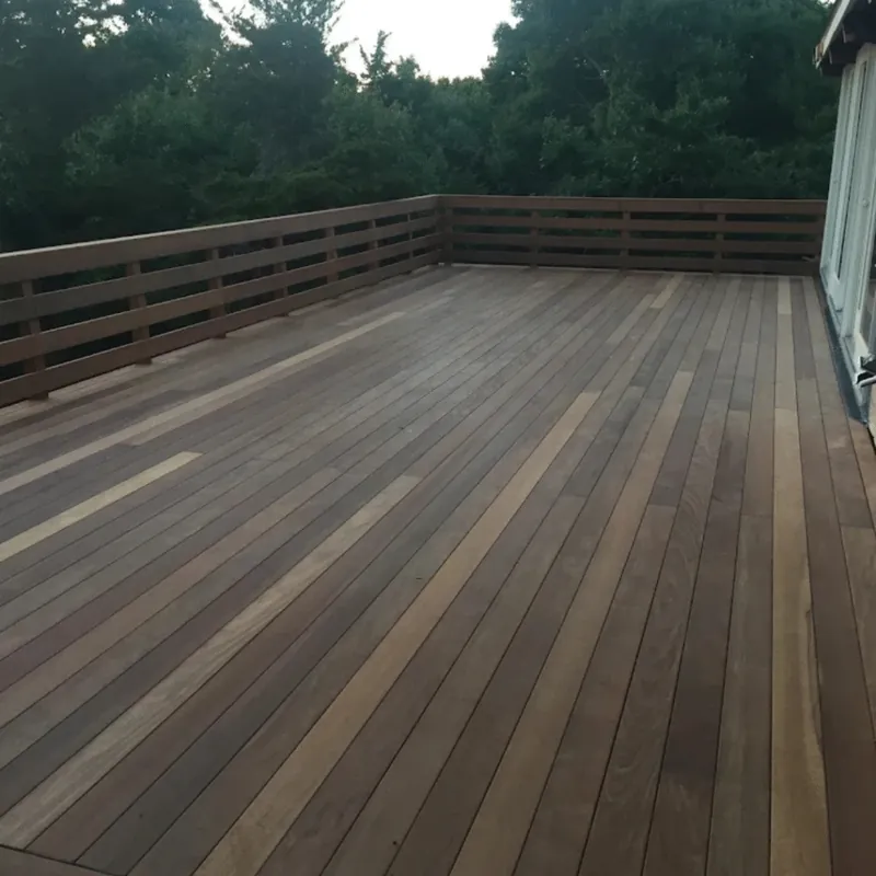 Hardwood deck with a stained rail